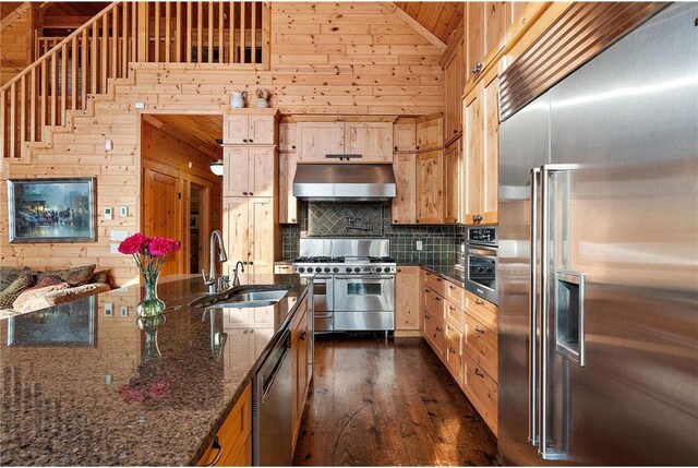 902 Sunrise Beach Dr, Amery, WI 54001 - kitchen with wooden walls, a sink, high quality appliances, and under cabinet range hood