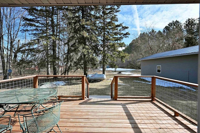 wooden deck featuring outdoor dining space