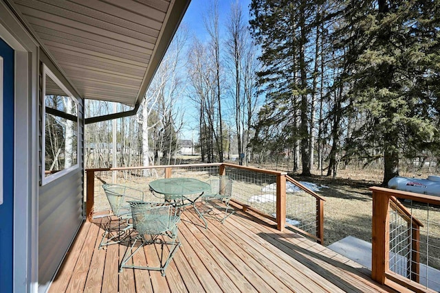 deck featuring outdoor dining area