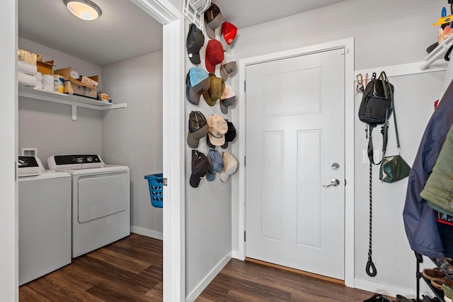 laundry room featuring dark wood-style floors, laundry area, baseboards, and washing machine and clothes dryer