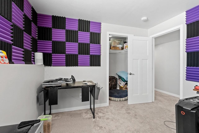 home office with carpet floors and baseboards