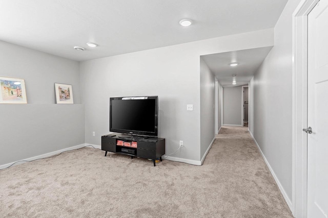 interior space featuring carpet floors and baseboards