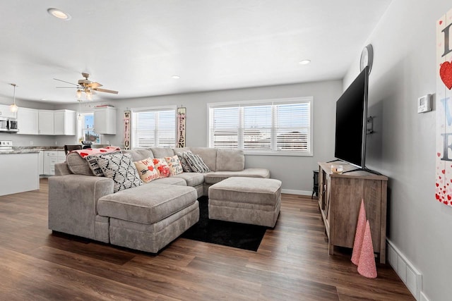 living room with recessed lighting, dark wood-type flooring, visible vents, a ceiling fan, and baseboards