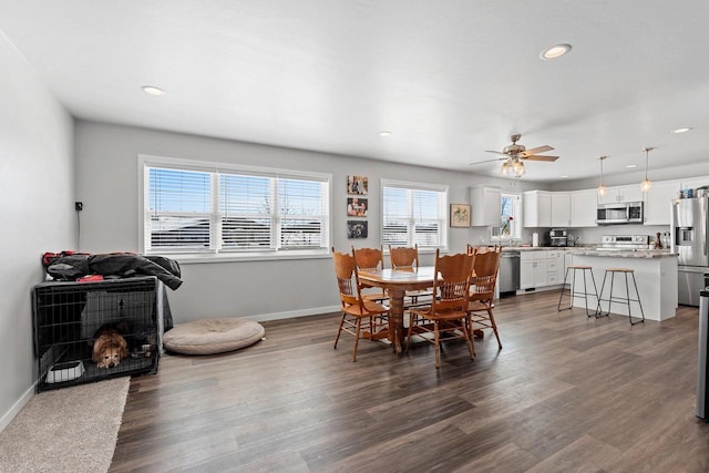 dining area with dark wood-style floors, recessed lighting, a ceiling fan, and baseboards