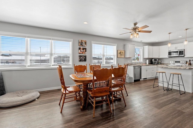 dining area featuring dark wood-type flooring, recessed lighting, ceiling fan, and baseboards