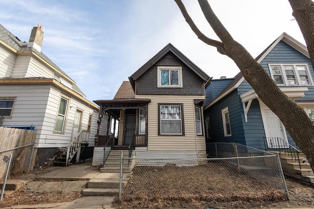 view of front of house with fence