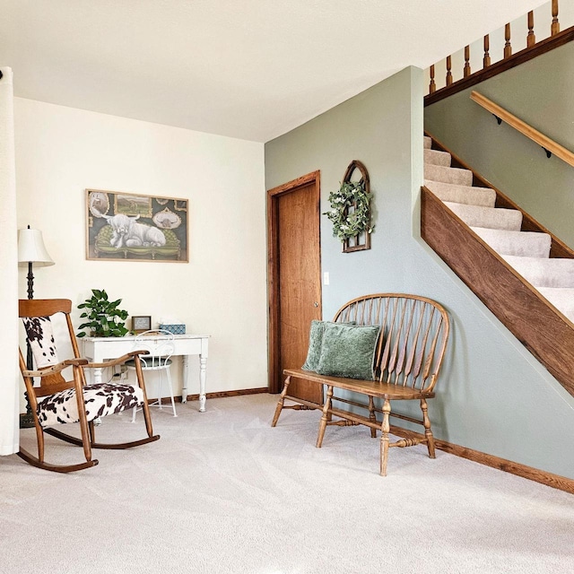 N3820 Fairwood Rd, Reeseville, WI 53579 - sitting room featuring carpet, baseboards, and stairs