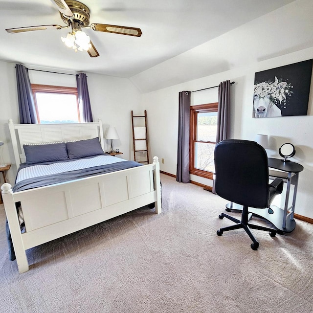 N3820 Fairwood Rd, Reeseville, WI 53579 - carpeted bedroom featuring lofted ceiling, baseboards, multiple windows, and a ceiling fan