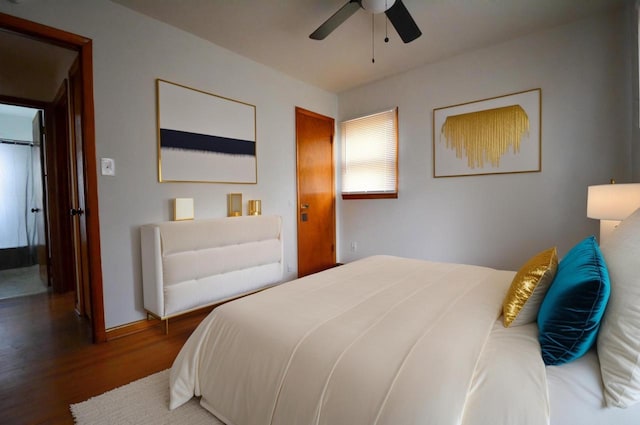 bedroom featuring wood finished floors and a ceiling fan