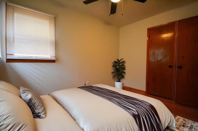 bedroom featuring ceiling fan and a closet