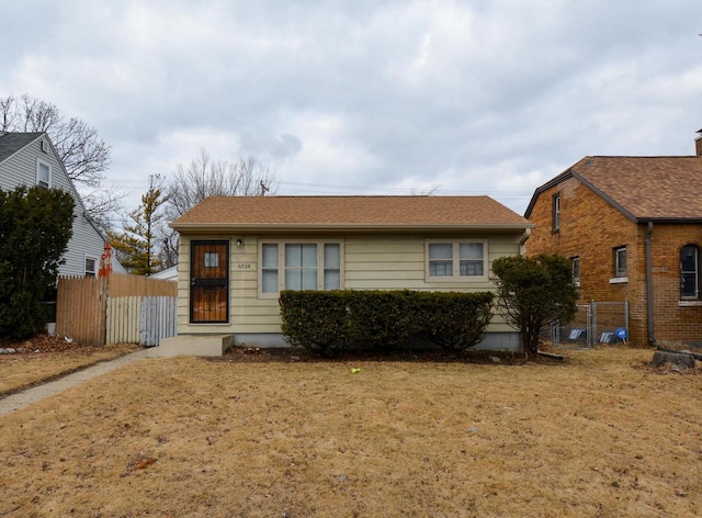 view of front of home featuring fence