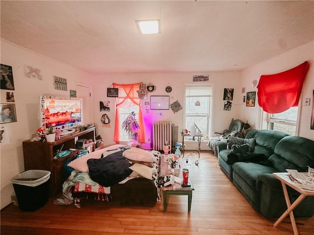 interior space featuring radiator and wood finished floors