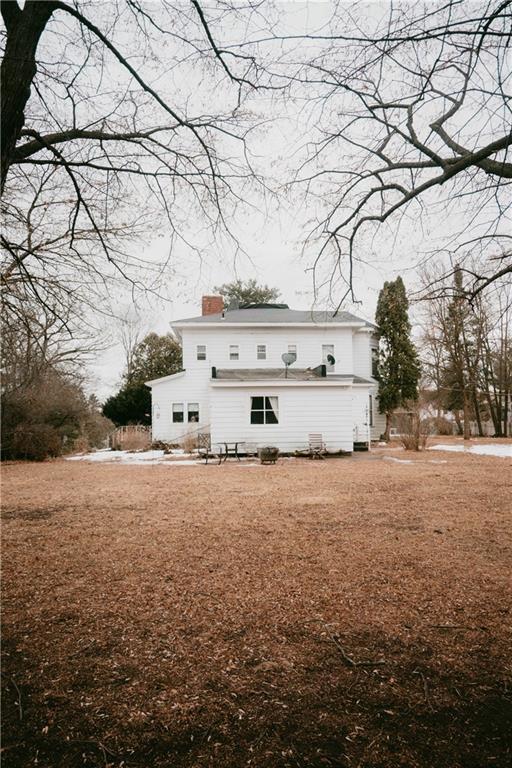 rear view of house with a chimney