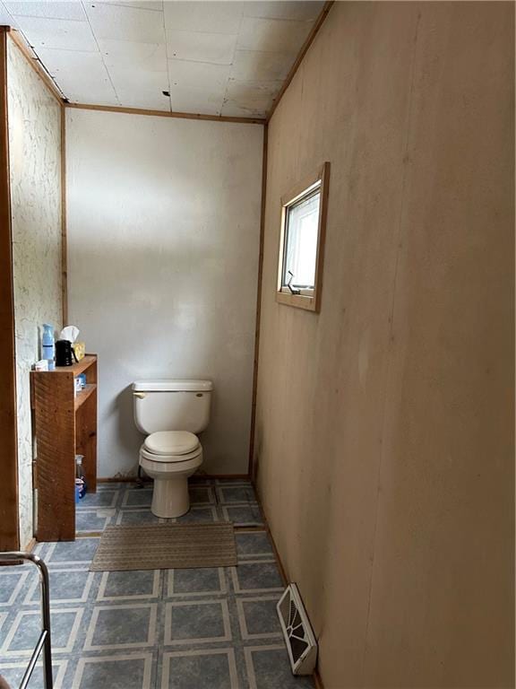 bathroom with toilet and visible vents