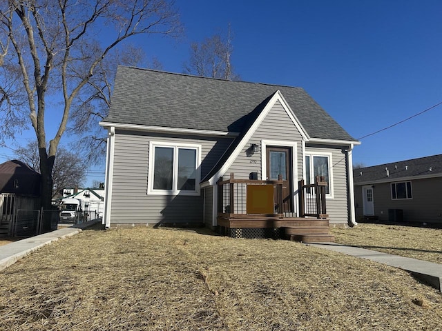 view of front of home with a shingled roof