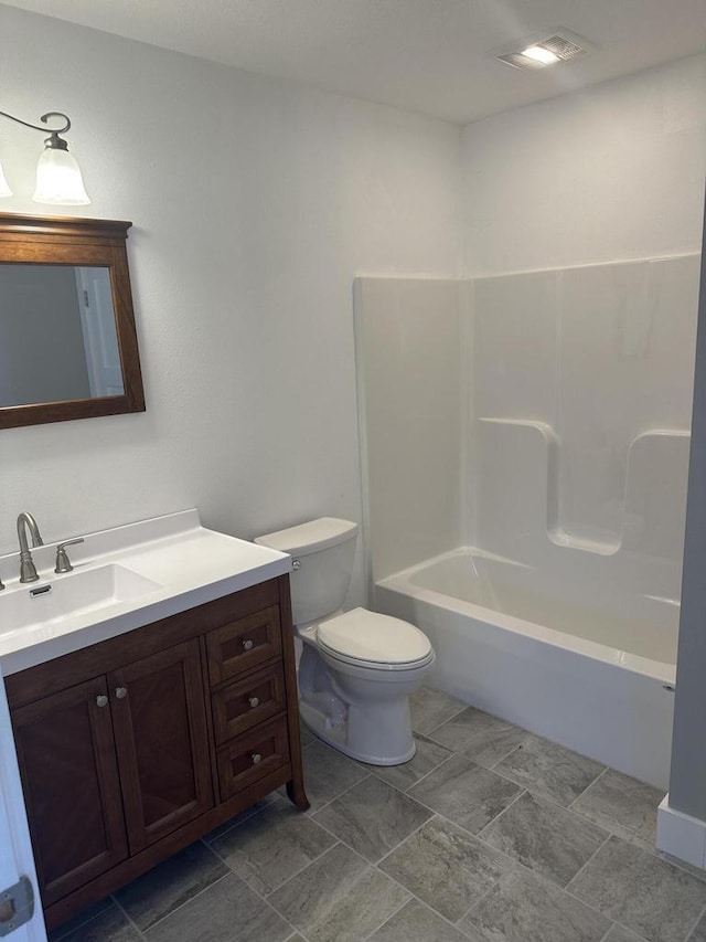 full bathroom featuring vanity, toilet, and bathing tub / shower combination