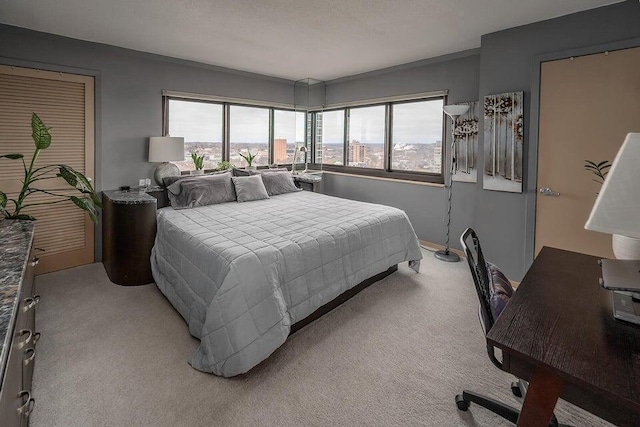 bedroom featuring light carpet and multiple windows