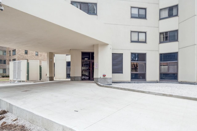 view of exterior entry featuring stucco siding