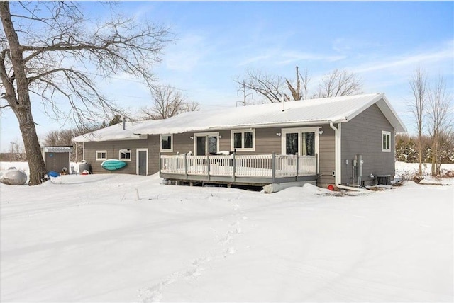 view of front of property featuring central AC and a deck