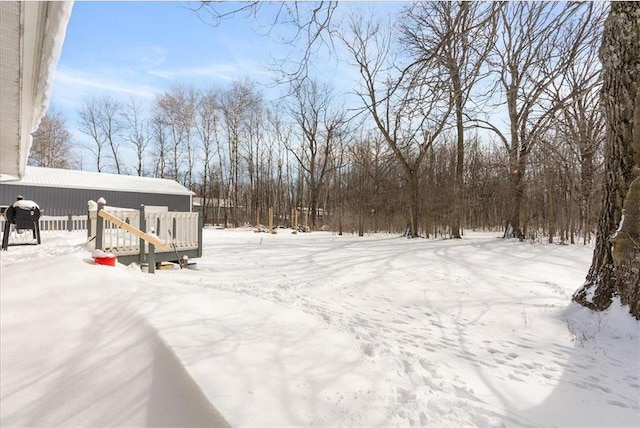 view of yard layered in snow