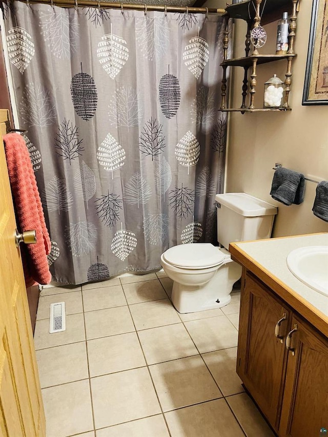 full bath featuring visible vents, vanity, toilet, and tile patterned floors