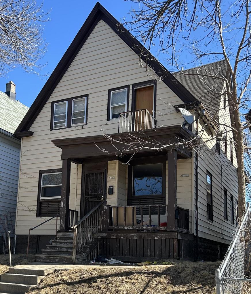 view of front of home featuring a chimney