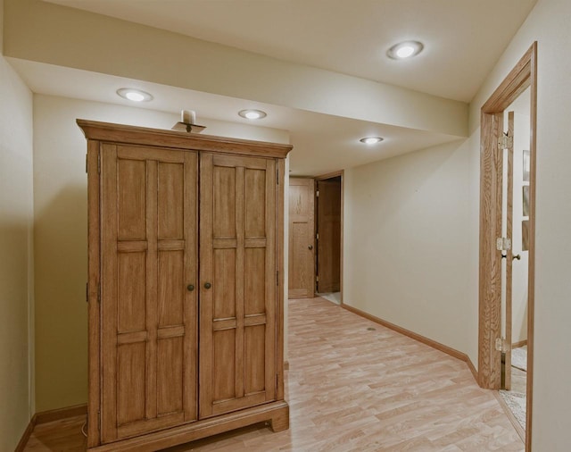 interior space with light wood-style floors, baseboards, and recessed lighting