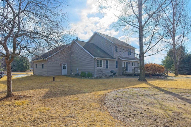 view of side of home featuring a yard