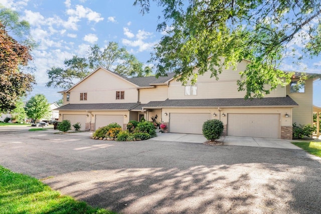 view of front of property featuring driveway and an attached garage