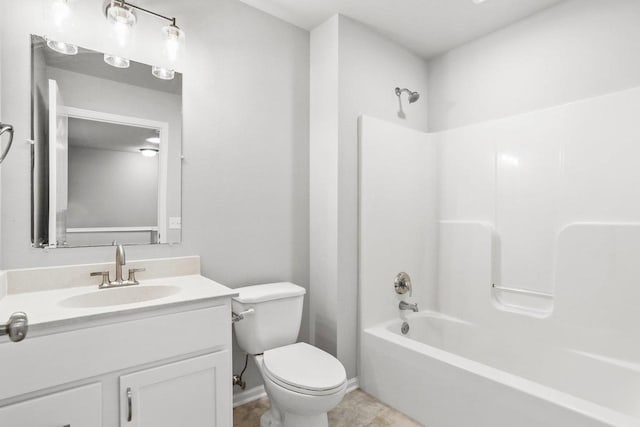 bathroom featuring vanity, toilet, and bathing tub / shower combination