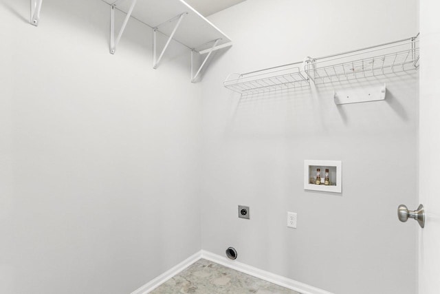 laundry area with baseboards, laundry area, hookup for a washing machine, and hookup for an electric dryer