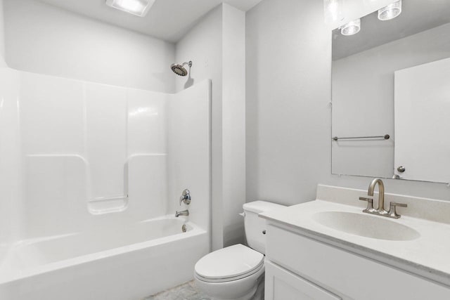 bathroom with bathing tub / shower combination, vanity, and toilet