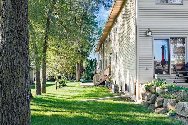 view of side of home featuring a yard