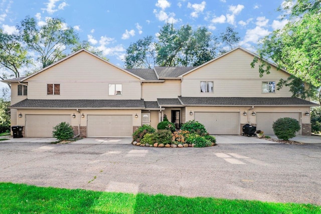 townhome / multi-family property featuring brick siding