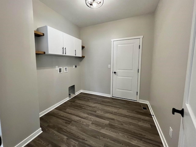 laundry room with dark wood-style floors, washer hookup, cabinet space, hookup for an electric dryer, and baseboards