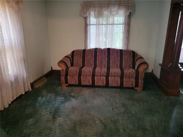 living area with carpet and baseboards