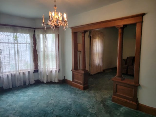 interior space with a notable chandelier and baseboards