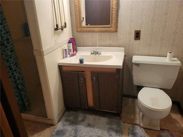 full bath featuring baseboards, vanity, toilet, and wallpapered walls