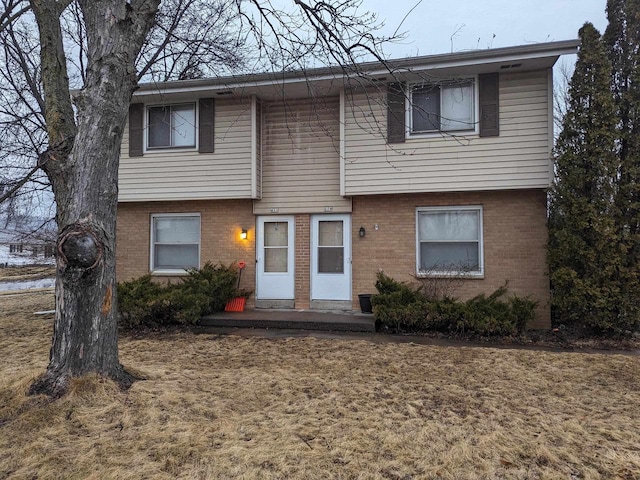 view of front of property featuring brick siding