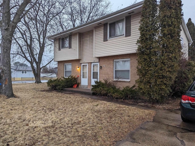 view of front of house with brick siding