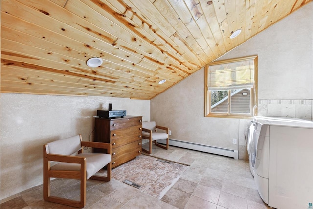 washroom featuring laundry area, wood ceiling, baseboard heating, and washing machine and dryer