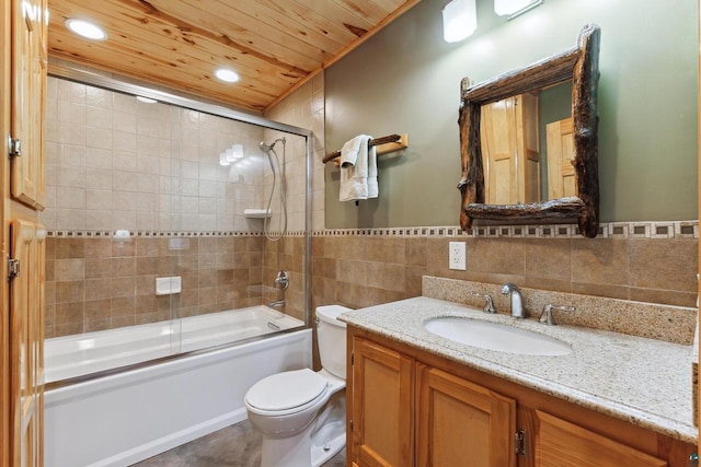 full bathroom with tile walls, toilet, wood ceiling, enclosed tub / shower combo, and vanity