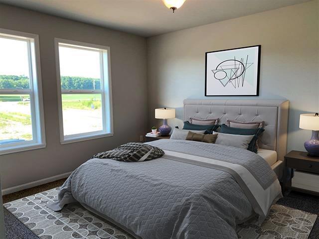 carpeted bedroom featuring baseboards