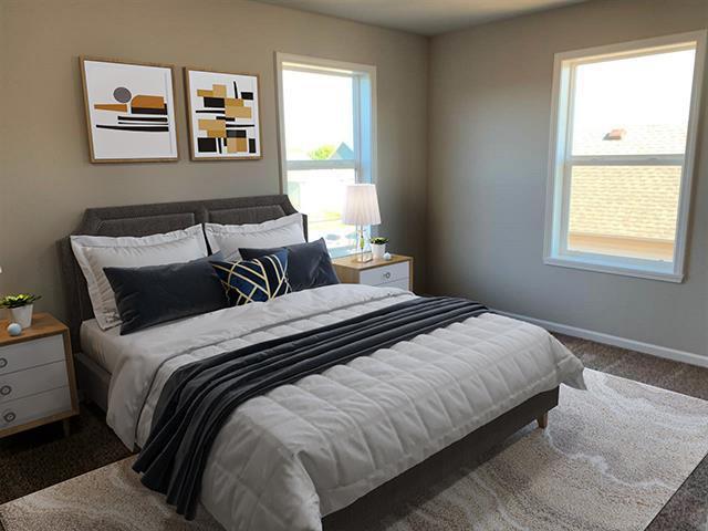 bedroom featuring baseboards, multiple windows, and carpet flooring