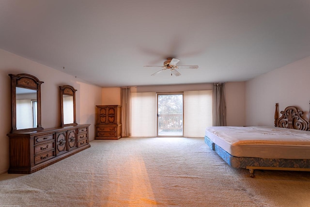 carpeted bedroom featuring ceiling fan and access to outside