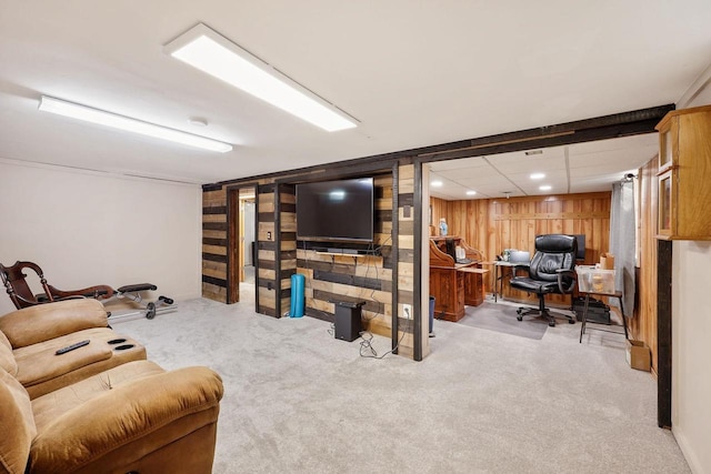 living area with wooden walls, recessed lighting, and carpet