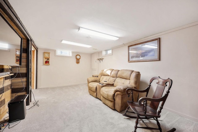 carpeted living area with baseboards