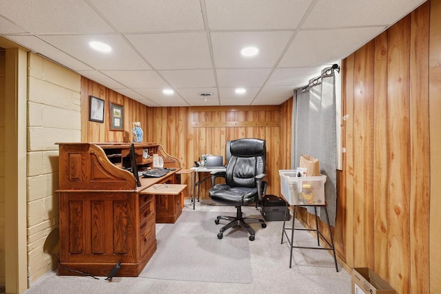 home office with recessed lighting, carpet floors, and wooden walls