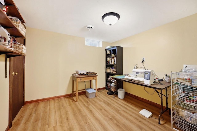 office area featuring visible vents, baseboards, and wood finished floors