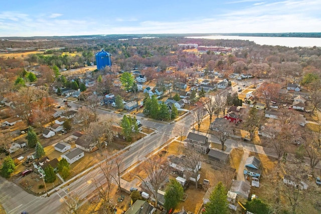 birds eye view of property with a residential view and a water view